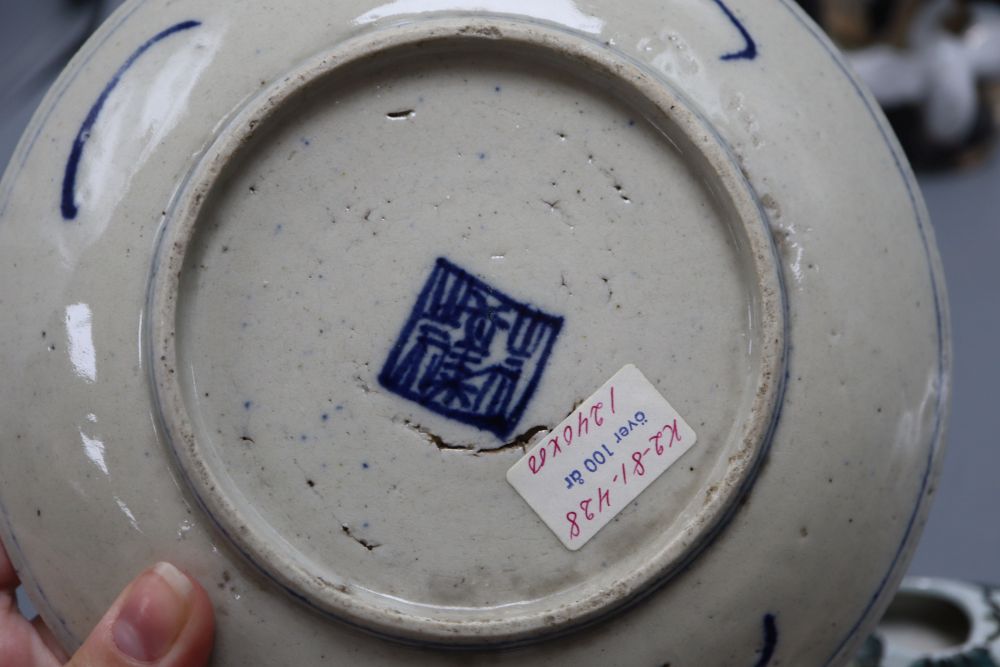 A Chinese blue and white dish, a wall pocket and a bird group, tallest 26cm